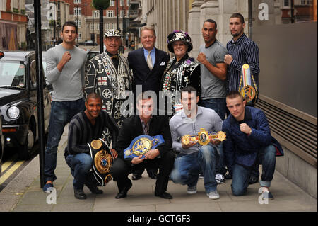 Frank Warren (rear centre) celebrates his 30th year as a promoter with Peggy and John, the Pearly King and Queen of Highgate, and his boxing charges before a press conference at the Grosvenor House Hotel, Park Lane, London. Stock Photo