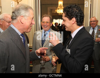 The Prince of Wales speaks to Daniel Murphy (centre) of Chefs Connection, and Chef Francesco Mazzei (right), at a reception to launch the London Welsh Lamb Club, at Clarence House, in central London. Stock Photo