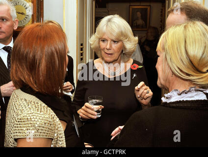 The Duchess of Cornwall talks to Rowena Elson and Deborah Morris (right), during a reception for supporters of the Welsh Guards Afghanistan appeal, at Clarence House in central London, this evening. Stock Photo