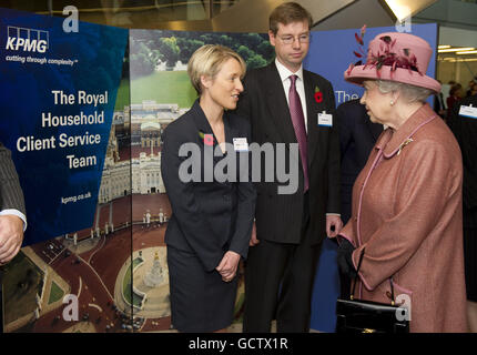 Queen Elizabeth II talks to staff members during a visit to mark the official opening of the new KPMG building at Canada Square in London's Docklands. Stock Photo