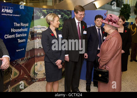 Queen Elizabeth II talks to staff members during a visit to mark the official opening of the new KPMG building at Canada Square in London's Docklands. Stock Photo