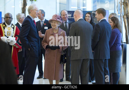 Queen Elizabeth II talks to KPMG Chairman John Griffith-Jones (left) during a visit to mark the official opening of the new KPMG building at Canada Square in London's Docklands. Stock Photo