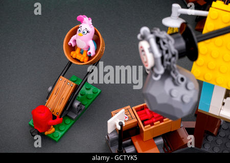 Tambov, Russian Federation - April 14, 2016 Lego Angry Birds. Red and Stella using catapult in Pig City. Studio shot. Stock Photo