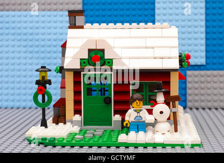 Tambov, Russian Federation - July 06, 2016 Lego Winter House. Girl building snowman in front of house. Studio shot. Stock Photo