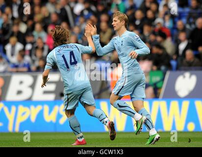 Tottenham Hotspur's Roman Pavlyuchenko (right) celebrates scoring his sides second goal of the game with teammate Luka Modric (left) Stock Photo