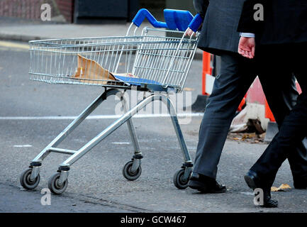 Court officials leave Derby Crown Court with a supermarket trolley, which was requested by the judge during the trial of Chief Inspector Kim Molloy, 44, from Nottinghamshire Police, leaves Derby Crown Court, who is accused of shoplifting make-up. Stock Photo