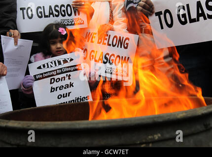 Protesters hold up banners during the Anti-UK Borders Agency demonstration outside the UKBA centre in Govan, Glasgow, Scotland. PRESS ASSOCIATION Photo. Picture date: Saturday November 20, 2010. See PA story SCOTLAND Asylum. Photo credit should read: Andrew/Milligan/PA Wire Stock Photo