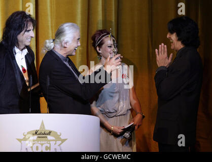 Jimmy Page (second left) presents Jaz Coleman (right) of Killing Joke with their Innovator Award, with hosts Alice Cooper and Sarah Cawood, at the Marshall Classic Rock Roll of Honour, at The Roundhouse in north London. Stock Photo