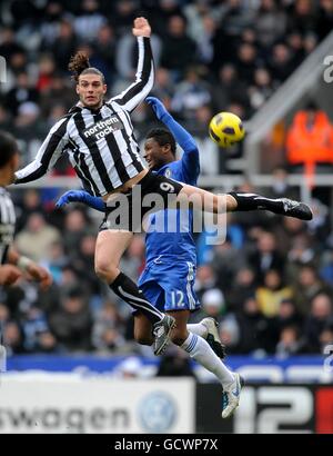 Soccer - Barclays Premier League - Newcastle United v Chelsea - St James' Park. Newcastle United's Andy Carroll (left) and Chelsea's Mikel rise high in a battle for the ball Stock Photo