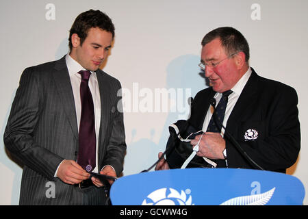 Rugby Union - 2010 EMC Autumn Test - Scotland v New Zealand - Murrayfield. Scotland's Ruaridh Jackson (left) receives his first cap from Scottish Rugby Union President Ian McLauchlan during the post match speeches Stock Photo