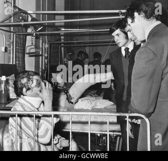 Alex McMartin, left, chats with Rangers' players, left to right, Derek Johnstone, Colin Jackson, and Dave Smith, who visited his bedside at the Victoria Infirmary. McMartin was among spectators injured in the Ibrox Park disaster. Stock Photo