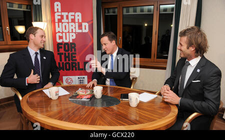 President of the Football Association, Prince William (left) with Britain's Prime Minister David Cameron and England 2018 Vice President David Beckham during a meeting to discuss the upcoming 2018 World Cup bid winners announcement on Thursday, at the Steigenberger Hotel in Zurich, Switzerland. Stock Photo