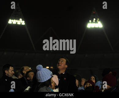 The Olympic Stadium floodlights are officially switched on by Prime Minister David Cameron at the Olympic Park in Stratford, London. Stock Photo