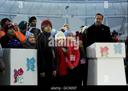 The Olympic Stadium floodlights are officially switched on by Prime Minister David Cameron at the Olympic Park in Stratford, London. Stock Photo