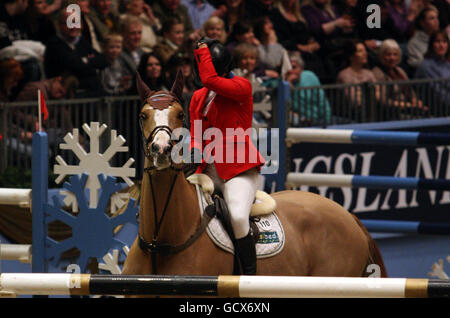 Great Britain's Ellen Whitaker holds her head after taking the wrong course in the Kingsland Olympia Grand Prix during the London International Horse Show at the Olympia Exhibition Centre, London. Stock Photo