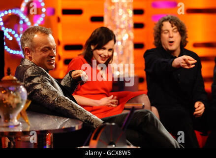 Host Graham Norton with guests Elizabeth McGovern (centre) and Alan Davies (right) during filming of the New Year's Eve edition of The Graham Norton show, at the London Studios. PRESS ASSOCIATION Photo. Picture date: Thursday December 16, 2010. Photo credit should read: Ian West/PA Wire Stock Photo