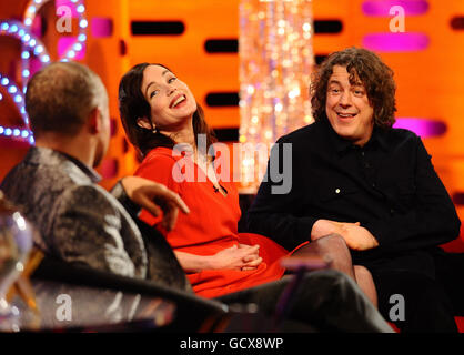 Host Graham Norton with guests Elizabeth McGovern (centre) and Alan Davies (right) during filming of the New Year's Eve edition of The Graham Norton show, at the London Studios. Stock Photo