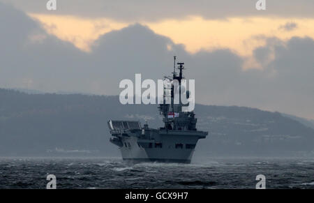 The Royal Navy's aircraft carrier HMS Ark Royal leaves the Clyde for the final time. Her farewell voyage will take her around the north of Scotland, before she makes a short journey down the north east coast of England and into Newcastle, where she was built by Swan Hunters at Wallsend. Stock Photo