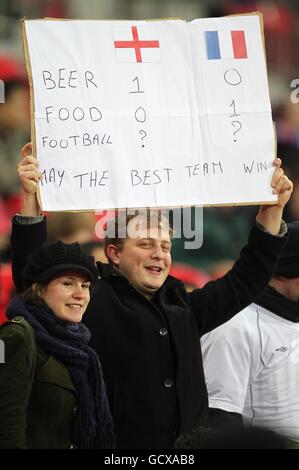 Soccer - International Friendly - England v France - Wembley Stadium. A fan holds a comical sign in the stands prior to kick-off Stock Photo