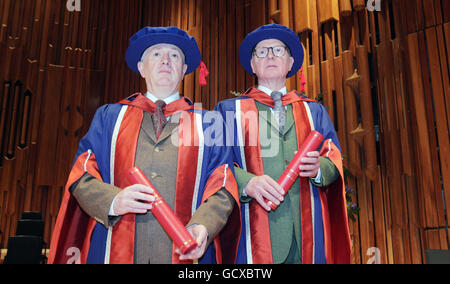 Artists Gilbert Proesch (left) and George Passmore (right) also known as Gilbert and George receive honorary doctorates from the University of East London at a ceremony at the Barbican centre. Stock Photo