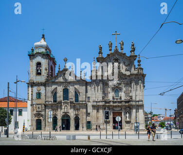 Porto, Portugal - June 24, 2016. People in front of principal facade of igreja dos Carmelitas church and Carmo church in Porto, Stock Photo