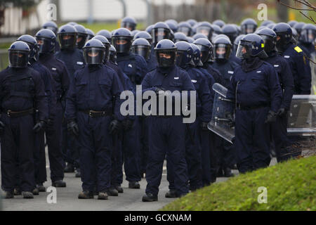 Specialist prison officers gather as they prepare to escort fire fighters at HMP Ford near Arundel, West Sussex after about 40 prisoners began a riot and set alight the open prison, according to the Ministry of Justice. Stock Photo