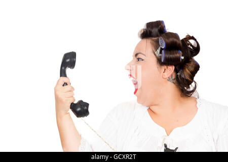 woman screaming at telephone Stock Photo