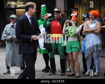 Prince William sees staff members dressed up for charity at inter-dealer broker ICAP as he arrives for the annual ICAP Charity Day in London. Stock Photo