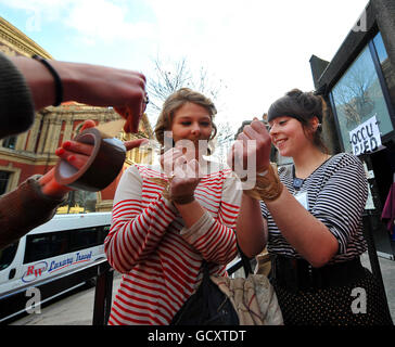 Students from the Royal College of Art in London, tape their mouths in protest against a rise in tuition fees outside their campus, before marching with a letter to Nick Clegg in Westminster protesting against a rise in fees. Stock Photo