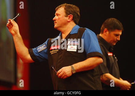 Terry Jenkins in action against Joe Cullen during the Ladbrokes.com ...