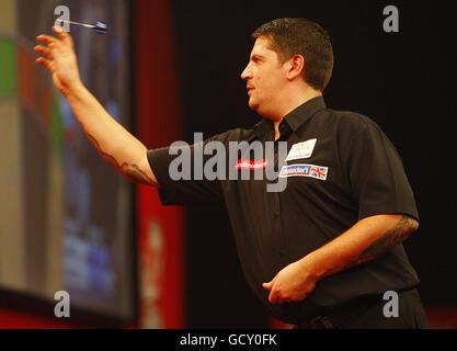 Terry Jenkins in action against Joe Cullen during the Ladbrokes.com ...