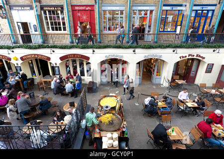 Restaurants and shops in a former market hall in Covent Garden district, people, London, England, United Kingdom, Europe Stock Photo