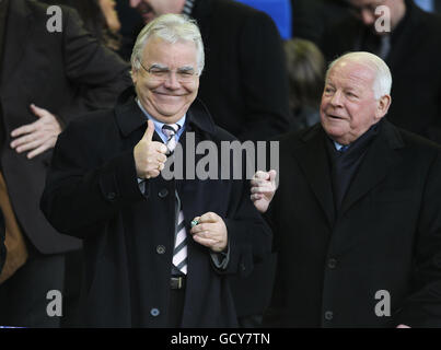 Everton chairman Bill Kenwright (L) gives a thumbs up to the fans along side Wigan chairman Dave Whelan (R) Stock Photo