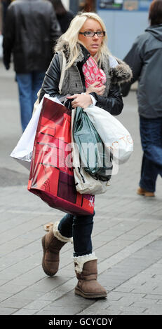 Christmas shoppers in Leeds City Centre purchase last minute gifts. Stock Photo