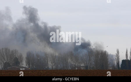 Smoke rises above HMP Ford near Arundel, West Sussex after about 40 prisoners began a riot and set alight the open prison, according to the Ministry of Justice. Stock Photo