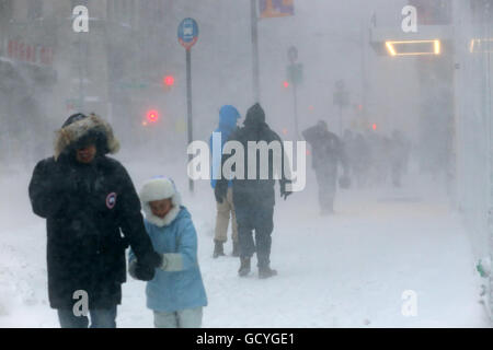 People brace themselves against high winds and heavy snow during the Winter Blizzard of 2016, New York City, January 23, 2016. snow squall snow storm