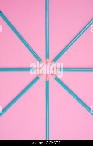 Many different colored pencils on pink background Stock Photo