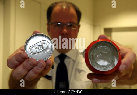 Assistant Director of UK Border Agency Grant Miller demonstrates devices used to drug traffic at Heathrow Airport. Stock Photo