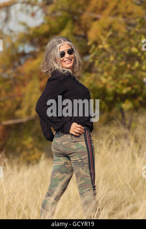 Attractive senior woman in wheat field Stock Photo - Alamy