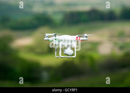 Camera drone in action in countryside, UK. Stock Photo