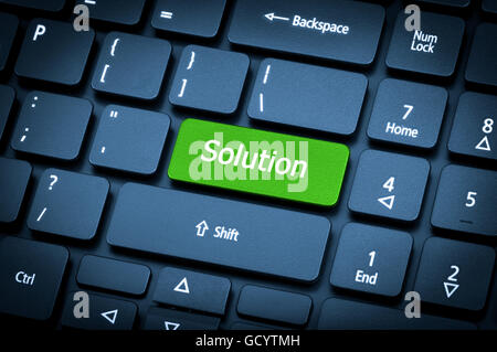 Close-up laptop keyboard. The focus on the Solution key. Toning is blue. Stock Photo