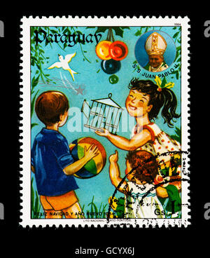 Postage stamp from Paraguay depicting children at Christmas.