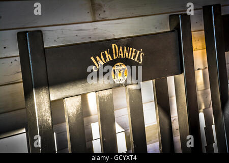 Detail of A branded Jack Daniel's No 7 Black wooden chair back on covered veranda at the Jack Daniel's Distillery in Lynchburg, Stock Photo