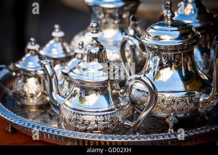 Table setting with silver tableware and dates. Oriental hospitality concept with tea or coffee cups Stock Photo