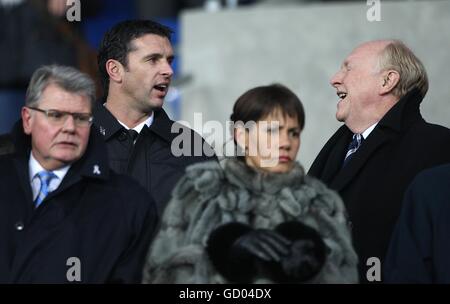 New Wales manager Gary Speed (2nd left) and former Labour leader Neil kinnock (right) in the stands Stock Photo