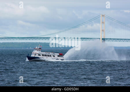 Michigan, Lake Michigan. Star Line Ferry in front of Mackinac Bridge (aka Big Mac or Mighty Mac). Stock Photo