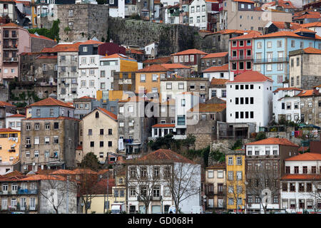 Old houses on steep hillside in city of Porto in Portugal, dense residential development Stock Photo