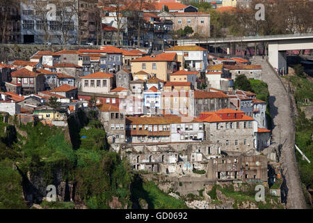 Old houses on steep hillside in city of Porto in Portugal, Calcada das Carquejeiras on right Stock Photo