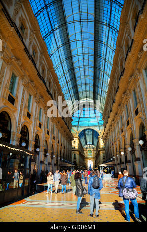 MILAN, ITALY - NOVEMBER 24: Galleria Vittorio Emanuele II shopping mall entrance with people on November 24, 2015 in Milan, Ital Stock Photo