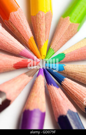 different colored pencils close-up lying on a circle Stock Photo